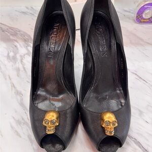 Alexander McQueen Black Leather Peep-Toe Heels with Gold Skull Accents